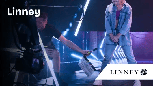 Linney case study thumbnail - woman standing in video studio-1-1